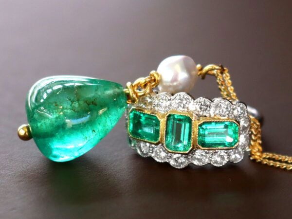 GIA certified emerald pendant with emerald ring