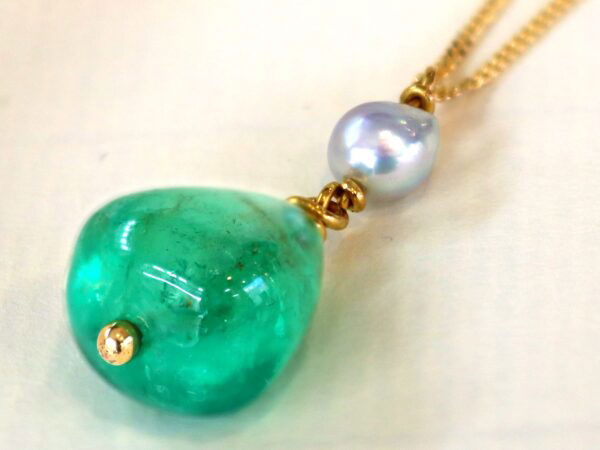GIA certified emerald pendant with pearl