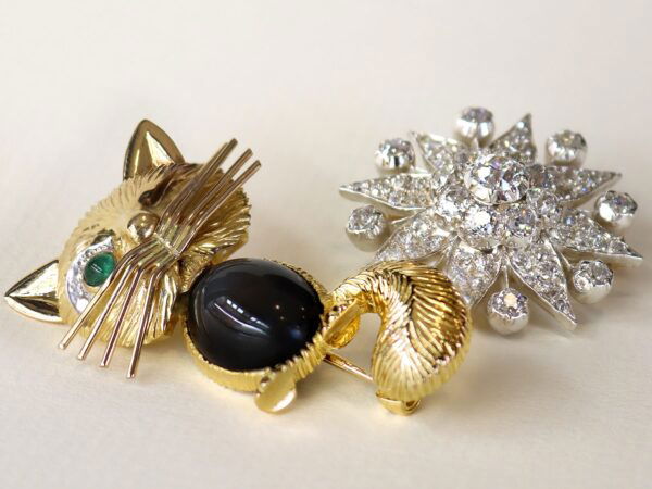 Edwardian diamond star brooch with cat brooch