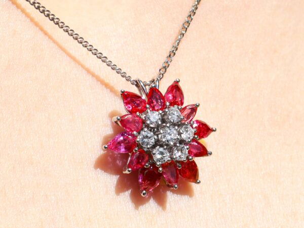 Floral Pear Cut Ruby Pendant being worn