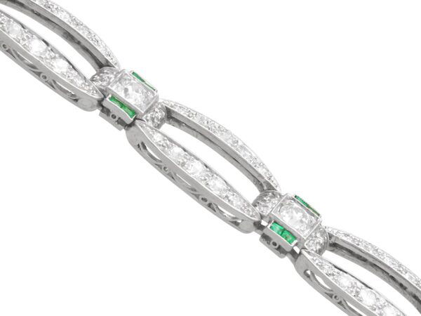 side of platinum art deco diamond and emerald bracelet