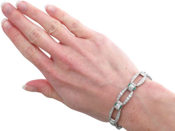 art deco diamond and emerald bracelet on hand