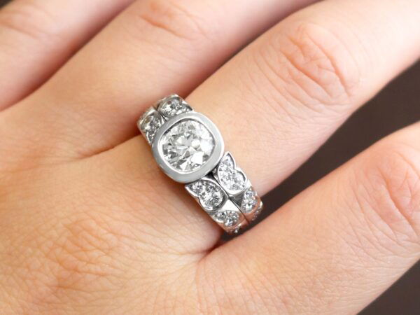 white gold 2 carat bezel set diamond ring on finger