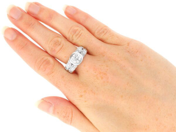 2 carat bezel set diamond ring on hand