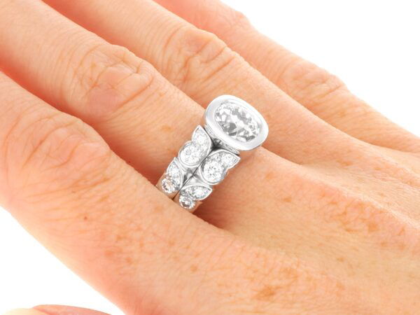 2 carat bezel set diamond ring on finger