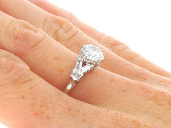 platinum Art Deco diamond ring on finger