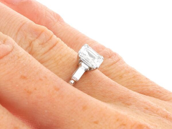 wearing an asscher cut diamond solitaire platinum