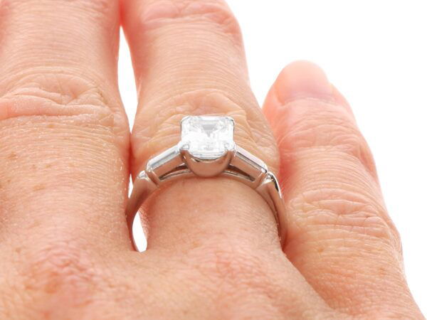 asscher cut diamond solitaire platinum on finger