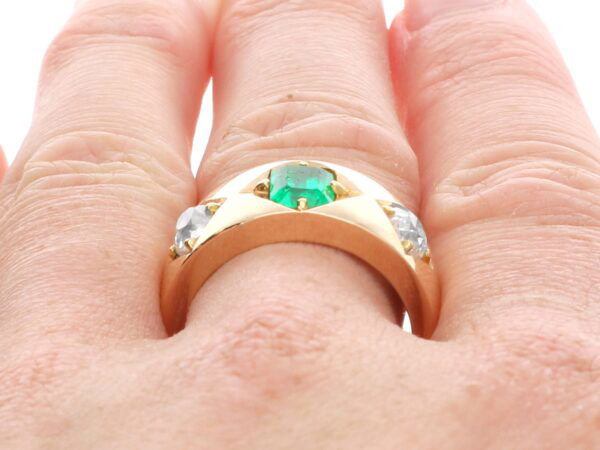 wearing antique emerald and diamond gold band
