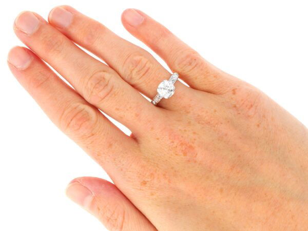 old European cut diamond solitaire ring in yellow gold on hand