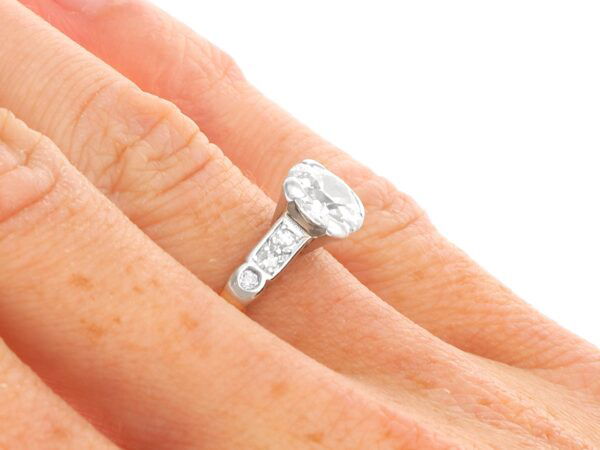 wearing old European cut diamond solitaire ring in yellow gold
