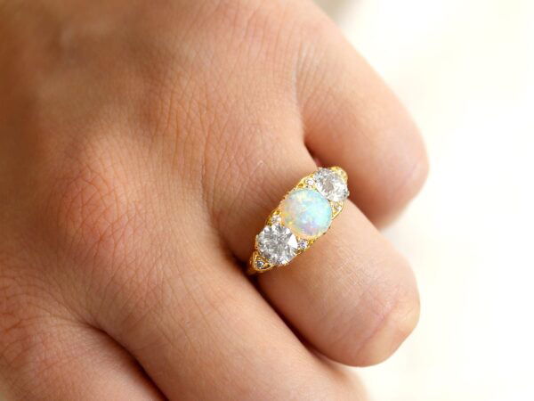 opal and diamond trilogy ring in gold