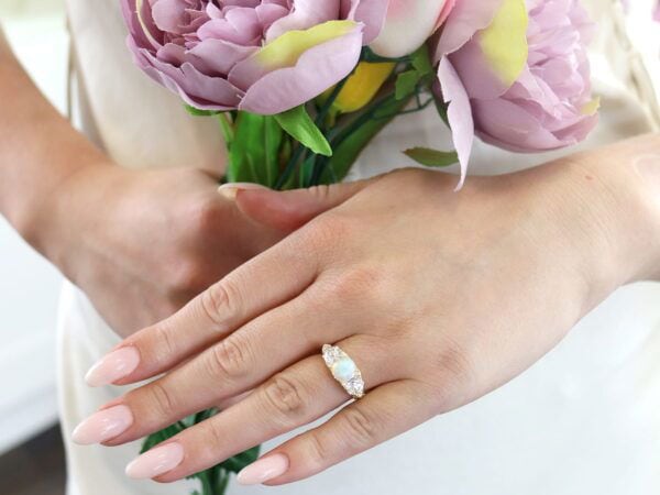 opal and diamond trilogy ring in yellow gold