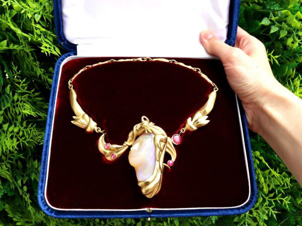 gold carved opal and ruby necklace in box