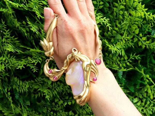 gold carved opal and ruby necklace outside