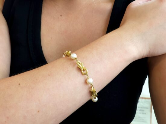 Gold And Pearl Bracelet On Wrist