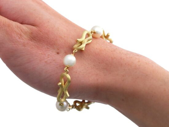 Gold and Pearl Bracelet On Hand