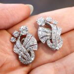 vintage art deco diamond earrings in the hand