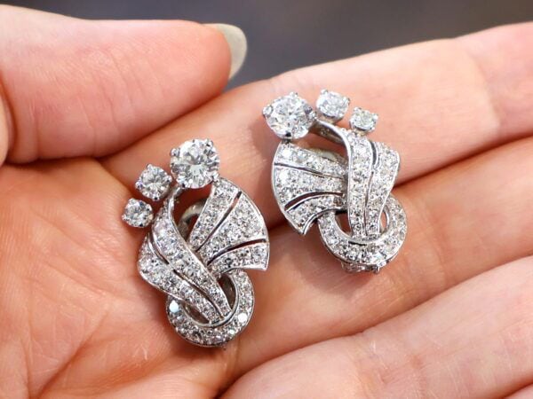 vintage art deco diamond earrings in the hand