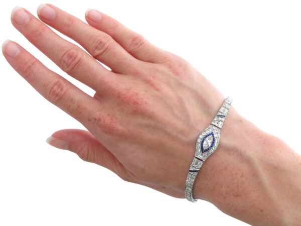 wearing a Art Deco Platinum Diamond Sapphire Bracelet