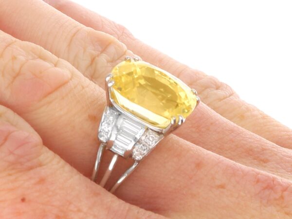 antique yellow sapphire ring on finger