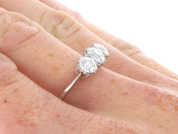 1920s 3 stone diamond ring on finger