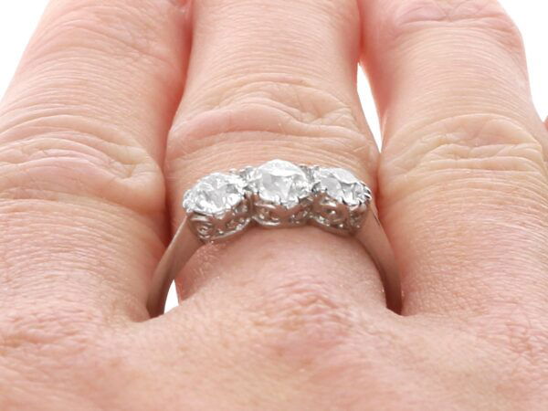 three stone diamond ring platinum on finger