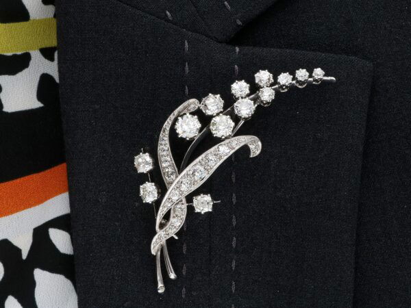 wearing diamond floral brooch