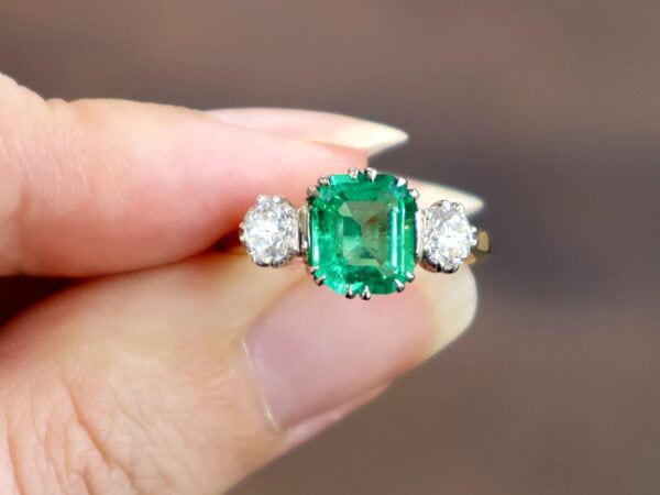 emerald trilogy engagement ring with diamonds