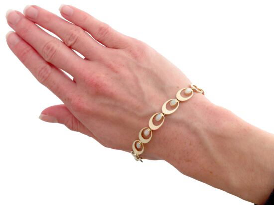 Gold And Pearl Bracelet On Wrist