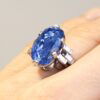 cushion cut Ceylon sapphire ring on finger