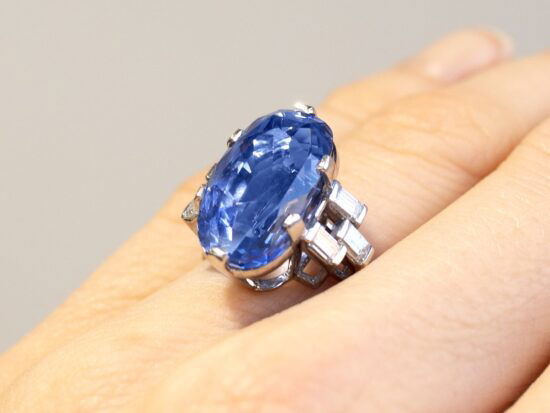 cushion cut Ceylon sapphire ring on finger