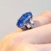 wearings a cushion cut Ceylon sapphire ring