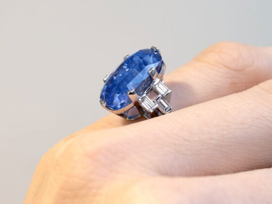 wearings a cushion cut Ceylon sapphire ring