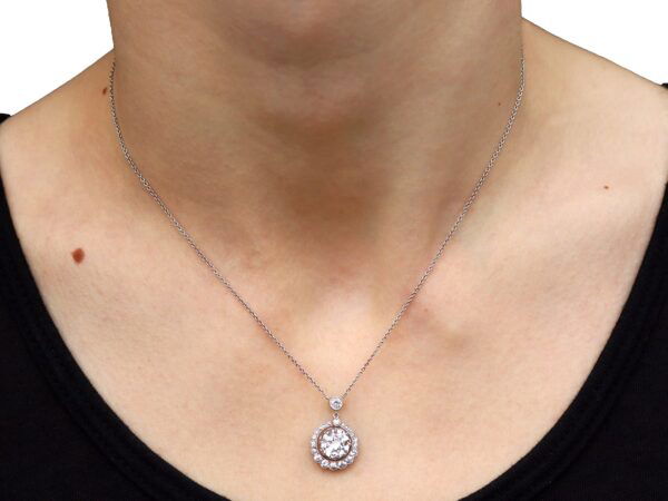 halo diamond pendant necklace on neck