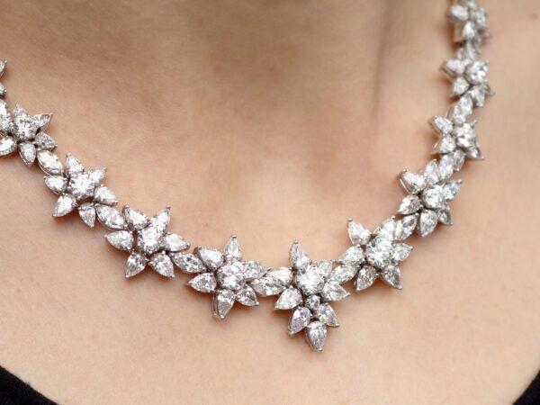 wearing a White gold floral diamond necklace