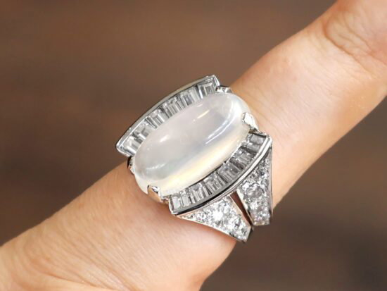 Platinum Moonstone and Baguette Diamond Ring on finger