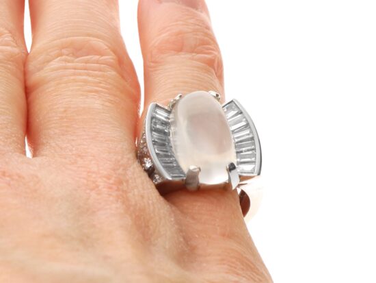 Platinum Moonstone and Baguette Diamond Ring on finger