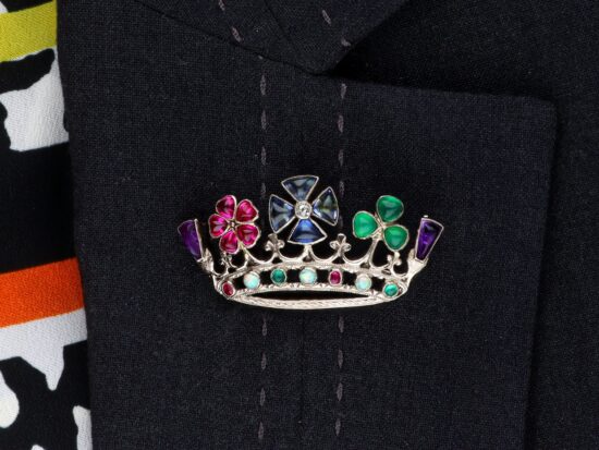 Multi-Gemstone White Gold Brooch Being Worn