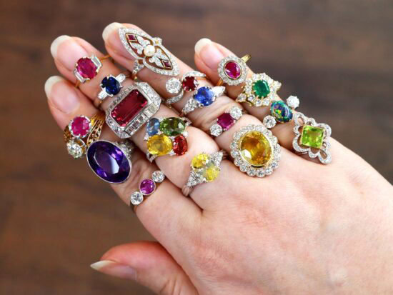 Gemstone and Diamond Rings On Hand