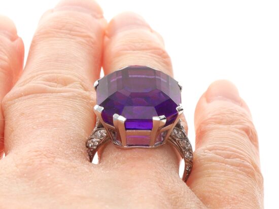 Close Up Wearing Amethyst Ring On Finger