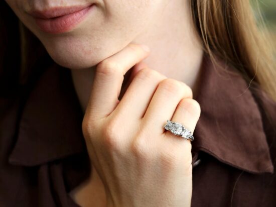 wearing 4.5 Carat Diamond Trilogy Ring in Platinum