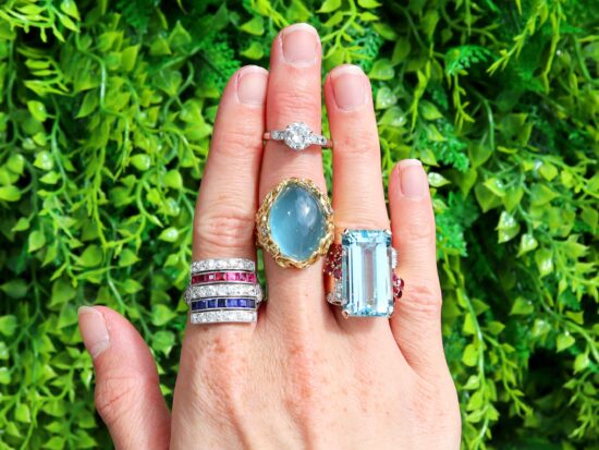 Gemstone and Diamond Rings On Hand Outside
