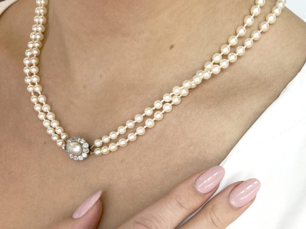 side view double strand pearl necklace