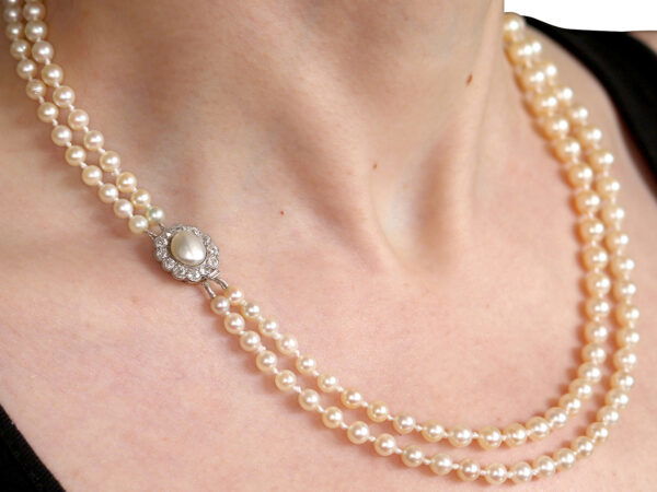 wearing a double strand pearl necklace