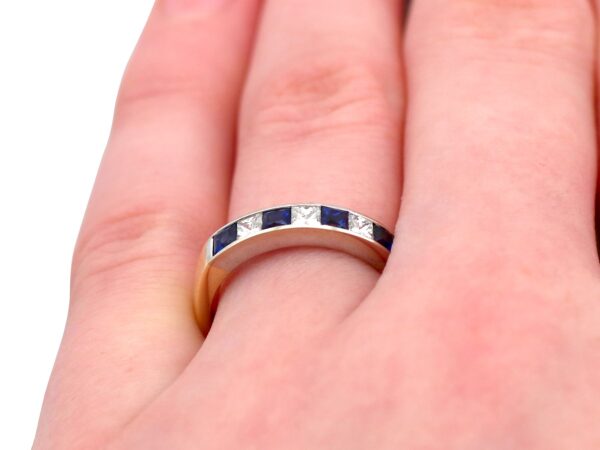 diamond and sapphire eternity ring on finger