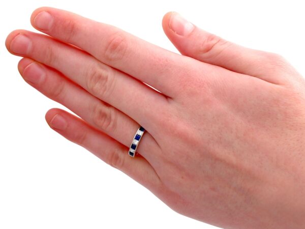 diamond and sapphire eternity ring on hand