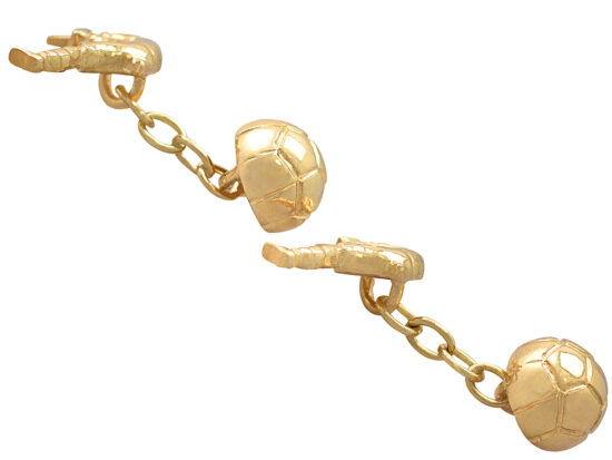 pair of gold footballer cufflinks