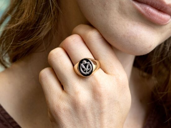 onyx signet ring on finger