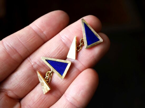 holding lapiz lazuli cufflinks